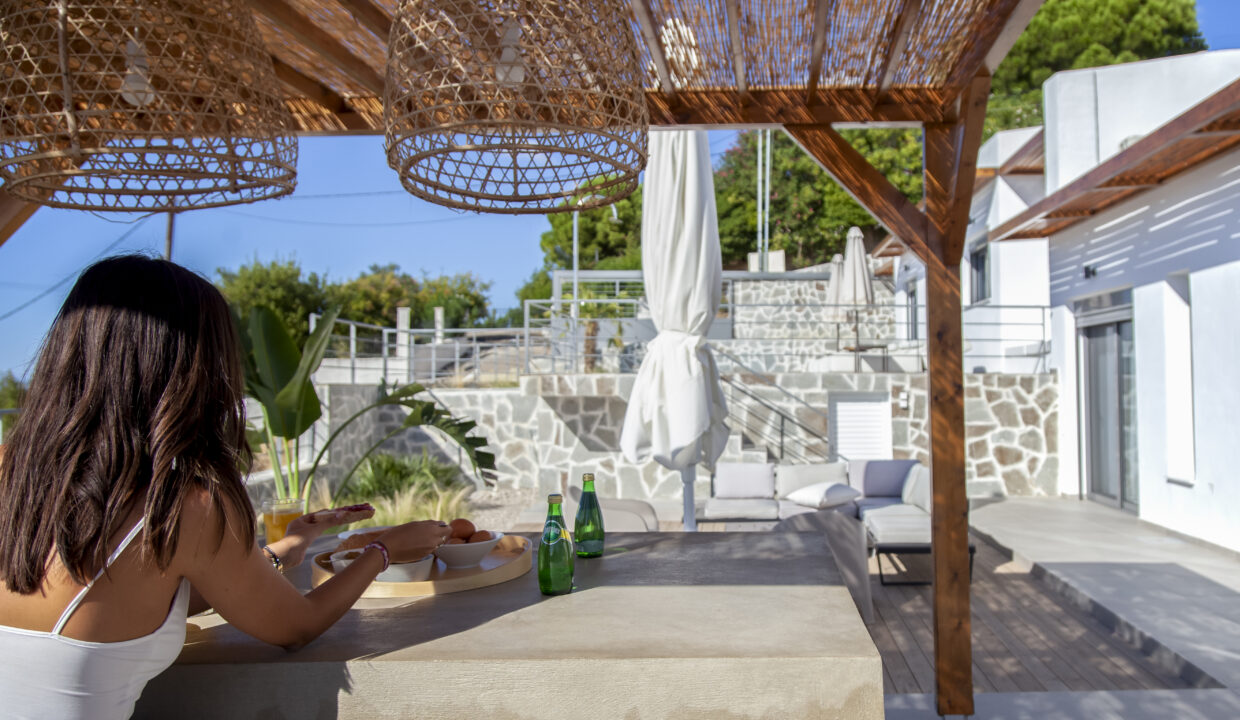 villa-empeiria-paleros-greece-girl-having-breakfast-at-outside-dining-area
