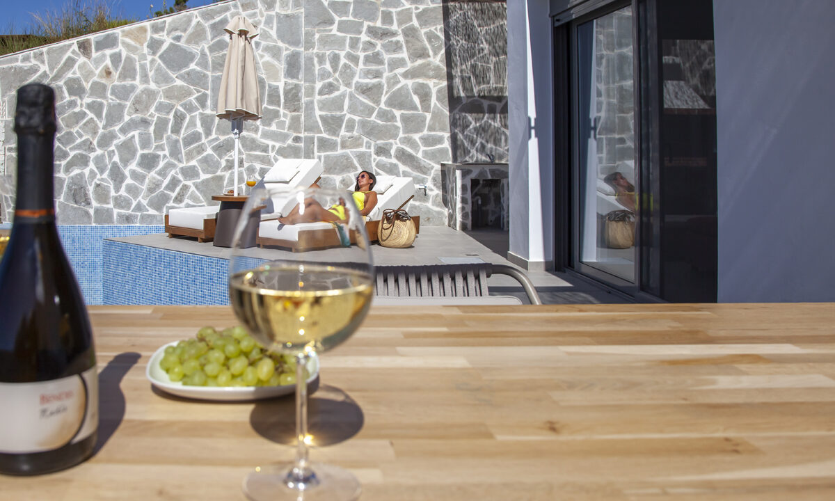 villa-petalouda-paleros-greece-dining-with-wine-bottle